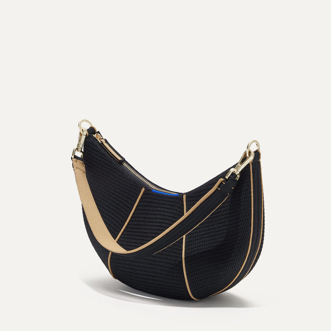 The Crescent Bag in Black, shown from the side. 
