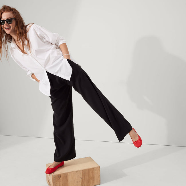 Alternate view of a model wearing The Ballet Flat in Glamour Red. 