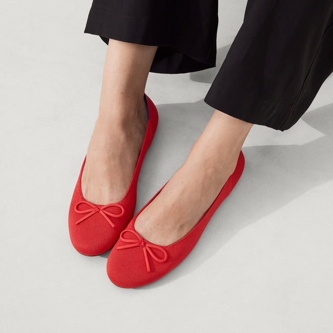 Model wearing The Ballet Flat in Glamour Red. 