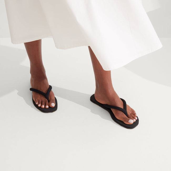 The Flip Flop in Black shown on-model at an angle.