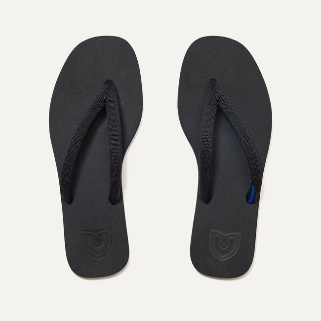 A pair of The Flip Flops in Black shown from the top view.