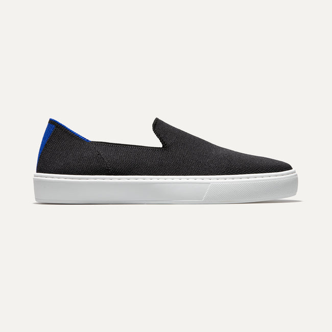 The slip-on Sneaker in Black Solid shown from a side view showing the outsole.