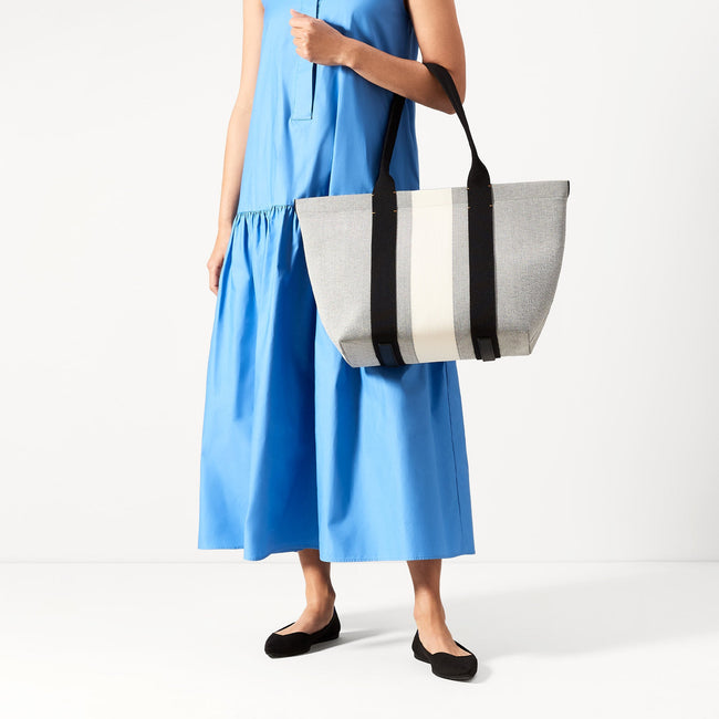Alternate view of The Essential Tote in Grey Mist worn by a model.