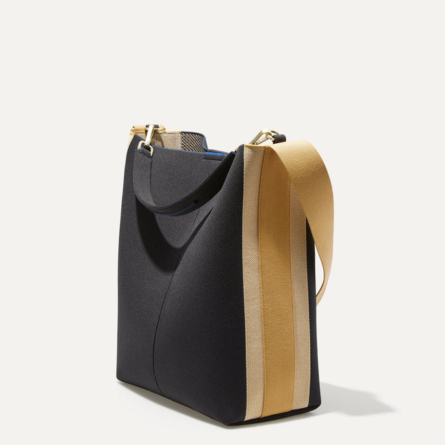 The Bucket Bag in Ink and Ivory shown in a diagonal view.