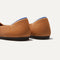 The Flat round toe shoe in Fawn shown from the back view with the heel detail.