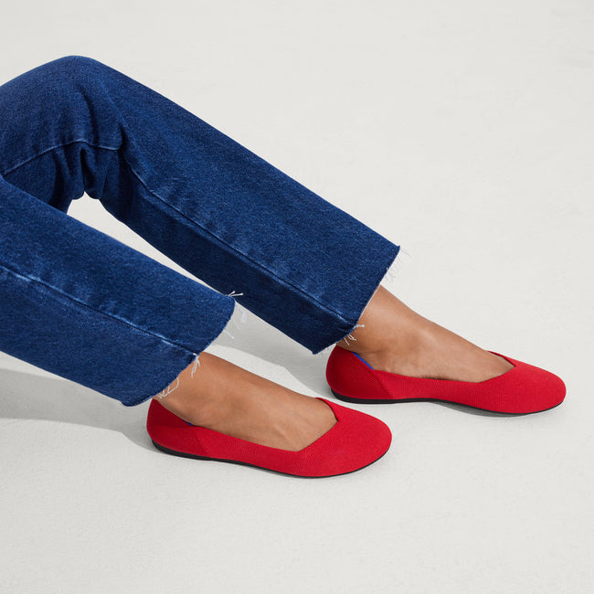 hover | Model wearing The Flat in Bright Red.