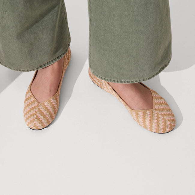 The Flat round toe shoe in Golden Hour shown on-model at an angle.
