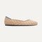The Flat round toe shoe in Golden Hour shown from a side view showing the outsole.