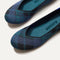 Close up of the rounded toe and v-shaped vamp of The Flat in Preppy Plaid. 