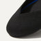 The Flat round toe shoe in Black Solid shown from the top view with detailing of the front of the shoe.