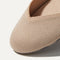 The Flat round toe shoe in Ecru shown from the top view with detailing of the front of the shoe.