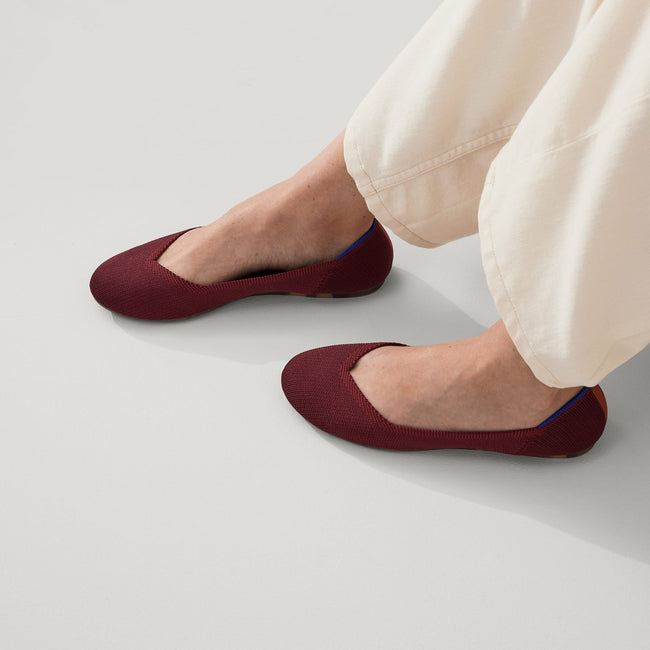 hover | Model wearing The Flat in Malbec Red. 