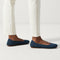 hover | Model wearing The Flat in Navy. 