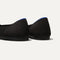 The Point shoe in Black Solid shown from the back view with the heel detail.