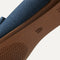 The sole of The Loafer in Navy shown in diagonal view. 