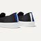 The slip-on Sneaker in Black Solid shown from the back view with the heel detail.
