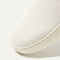 Close up of the toe and vamp of The Original Slip On Sneaker in Antique White. 