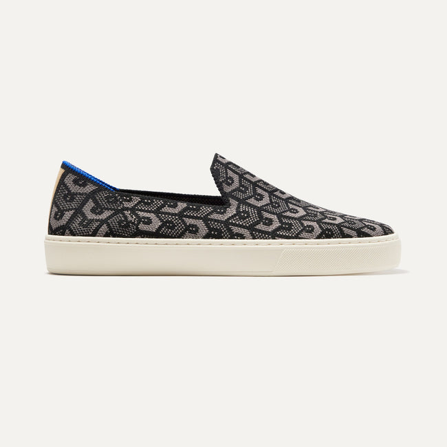 The Original Slip On Sneaker in Signature Black shown from the side. 