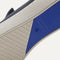 The sole of The Sneaker in Navy shown in diagonal view. 