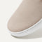 The slip-on Sneaker in Sand shown from the top view with detailing of the front of the shoe.
