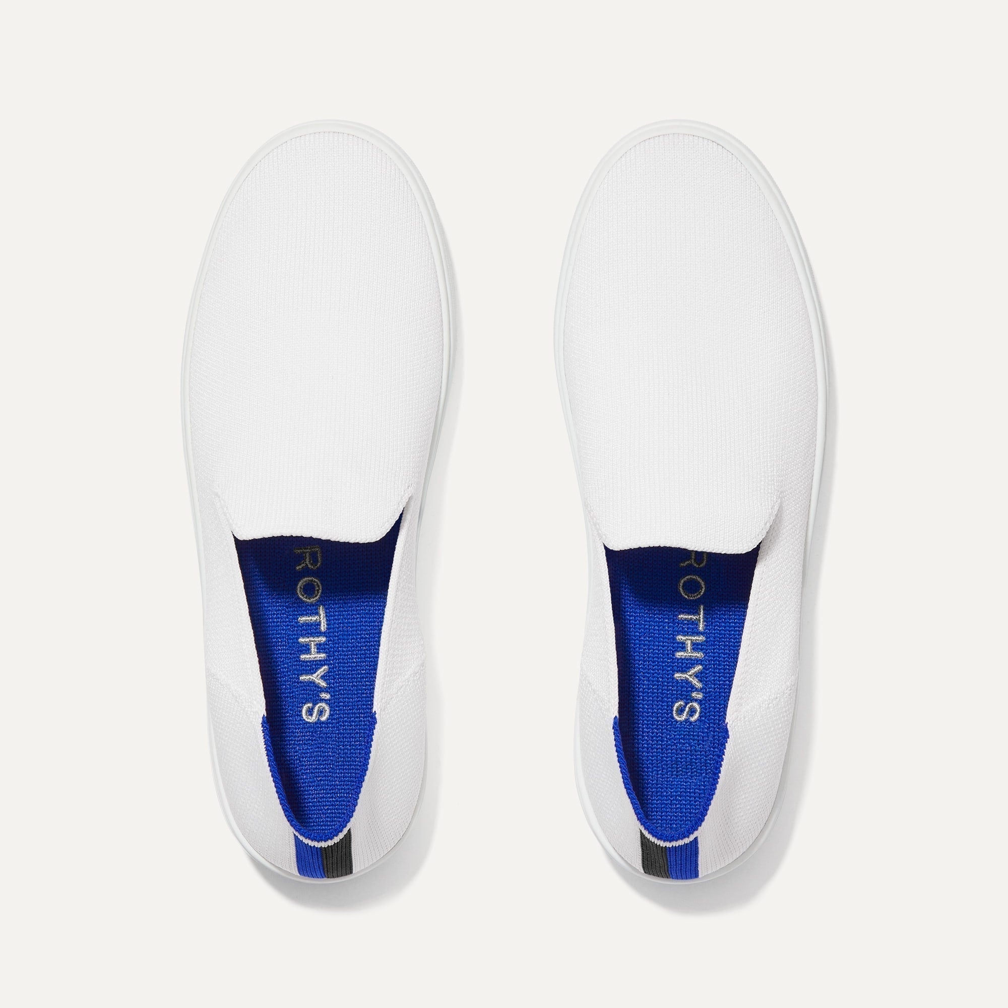 A pair of The slip-on Sneaker in Bright White shown from the top view.