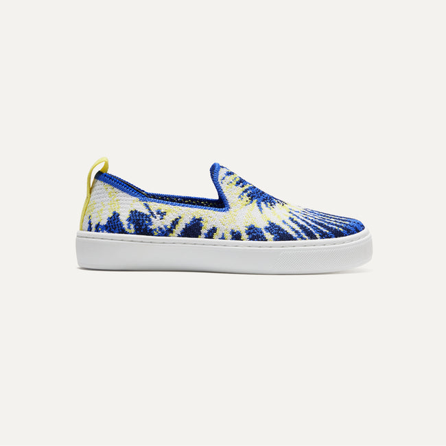 The Kids slip-on Sneaker in Blue Burst shown from a side view showing the outsole.