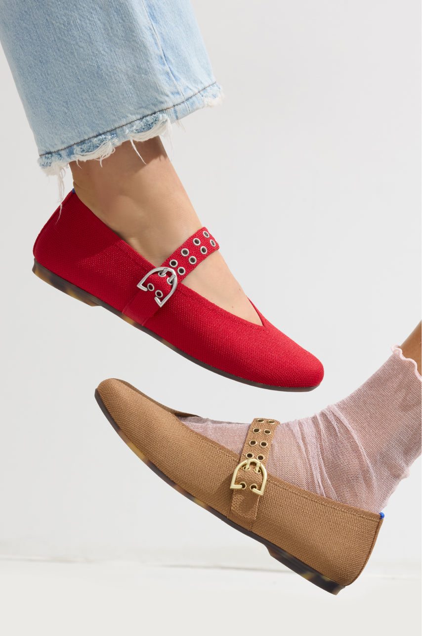 Two pairs of The Max Buckle Mary Jane in red, brown, on a light background.