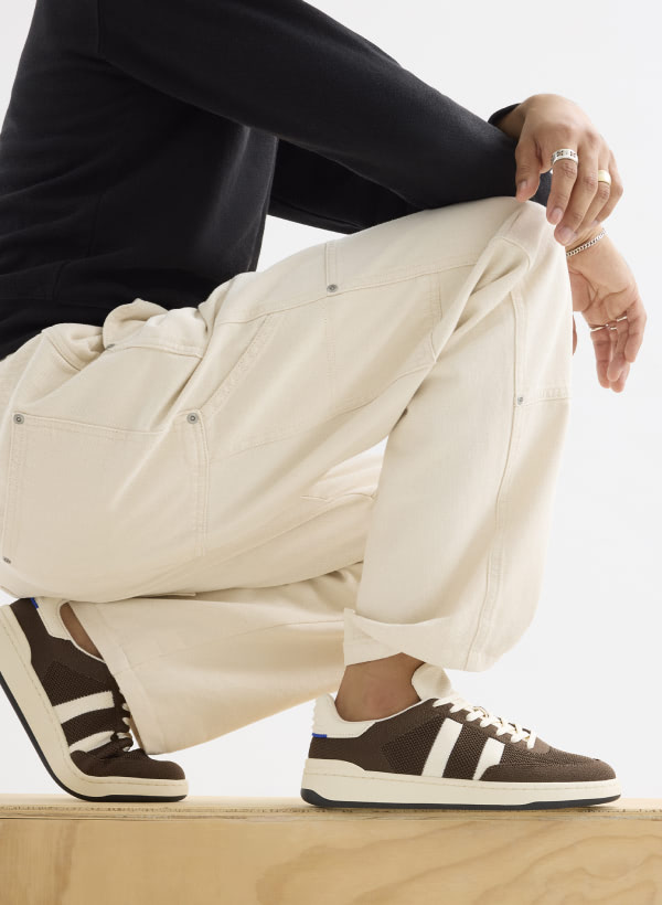 Model wearing The Men's Court Sneaker in Dugout.