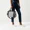 The Handbag in Grey Mist shown on model.