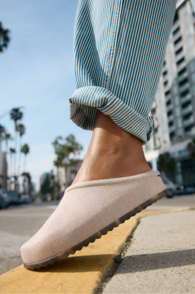 Close up shot of model wearing The Casual Clog in Dove.
