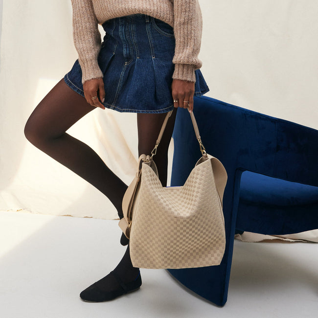 The Bucket Bag in Knot Brown shown on model. 