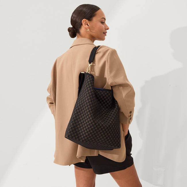 The Bucket Bag in Night Song shown on model. 