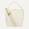 The Bucket Bag in White Sand shown from the front.