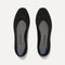 A pair of The Square toe flat shoe in Black shown from the top view.