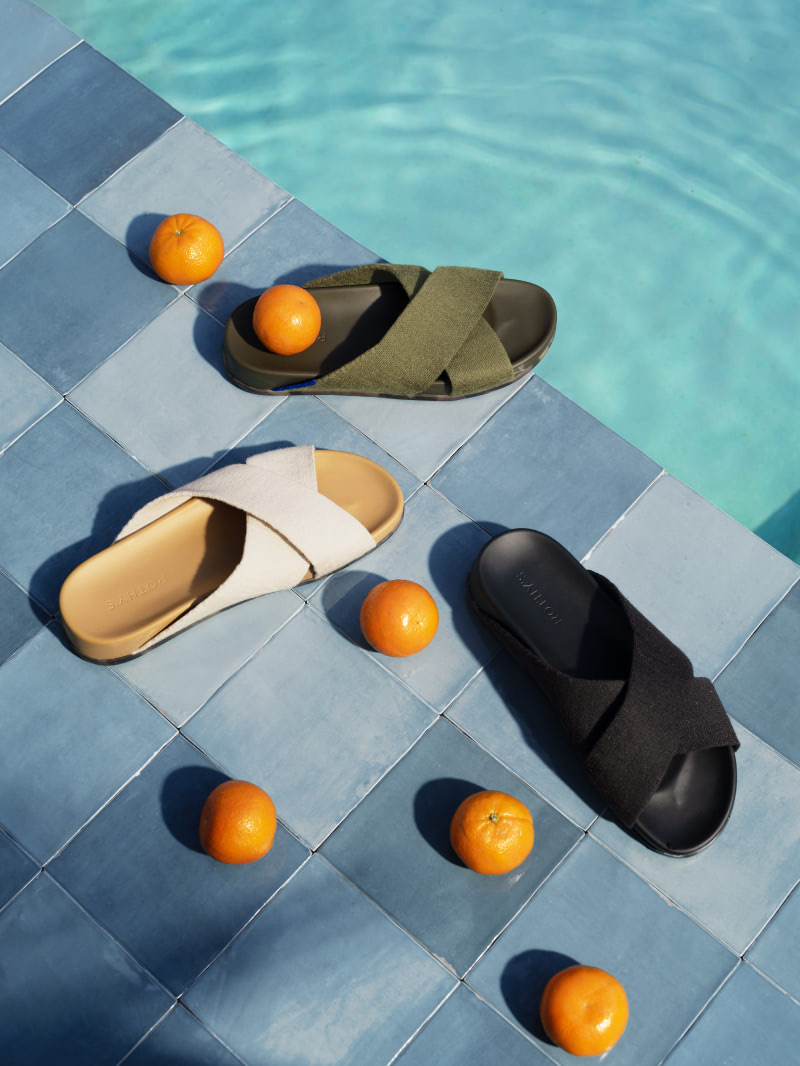 The Weekend Slide shown in Oat, Garden, and Black next to an outdoor pool.