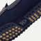 Close up of the outsoles of The Driving Loafer in Amalfi Blue, with raised nub details and the Rothy's signet on the base of the shoe. 
