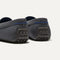 Close up of the heel of The Driving Loafer in Graphite Grey, with raised nub outsoles and Rothy's signature blue halo. 