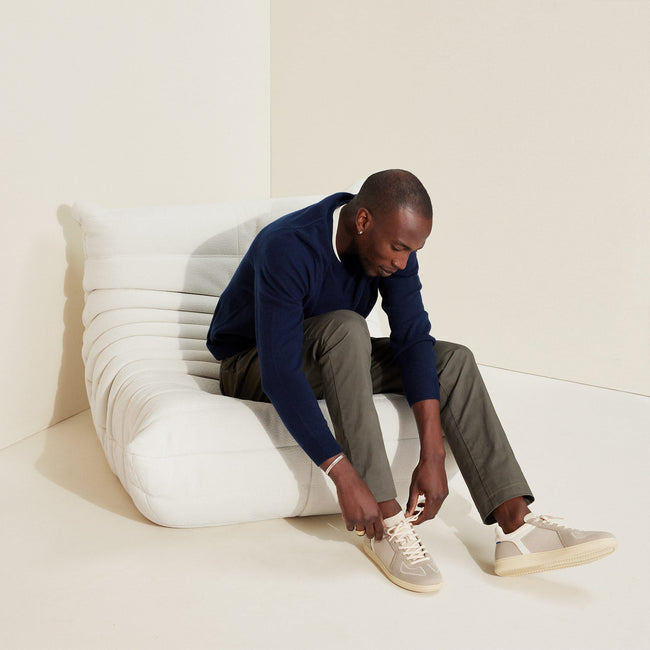 Alternate view of a model wearing The RS01 Sneaker in Palm Grey. 