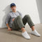 Alternate view of a model wearing The RS01 Sneaker in White.
