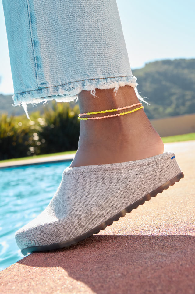 Close up shot of person wearing The Casual Clog in Dove. 