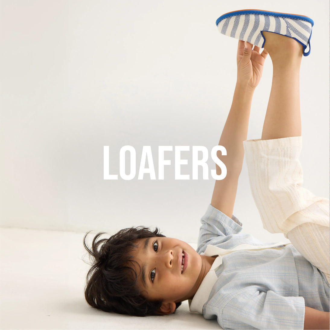 Child wearing The Mini Loafer for Kids, with text overlay ' Loafers.'