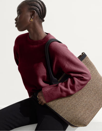Model carrying The Lightweight Zip Tote  in Cacao Herringbone.