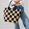 hover | Model holding The Lightweight Tote in Checker Classic.