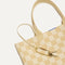 Close up of the handles and key leash detail of The Lightweight Tote in Checker Sand. 
