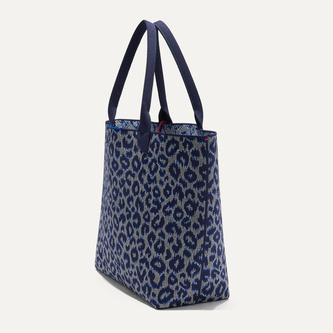 The Lightweight Tote in Indigo Cat shown in diagonal view.