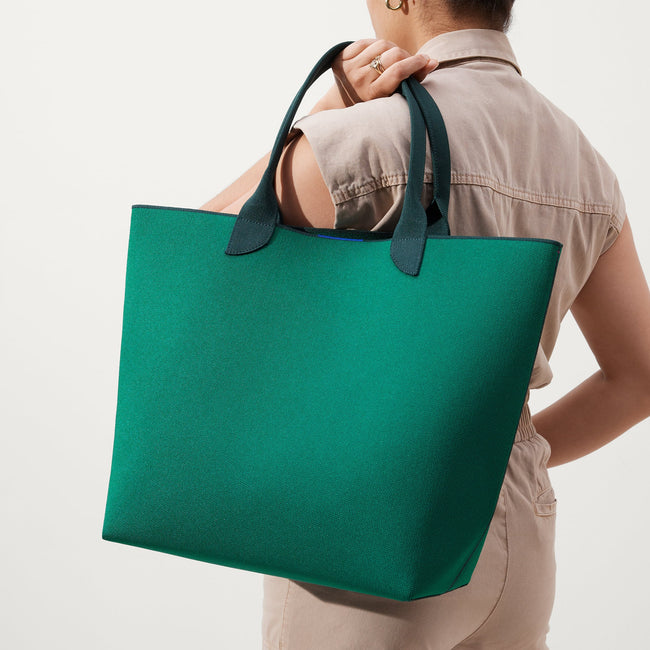 An alternate view of model holding The Lightweight Tote in Ivy League.