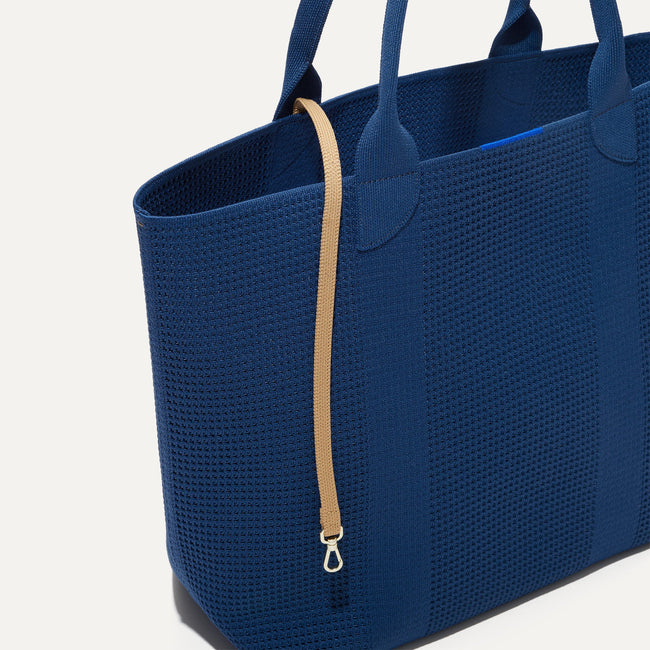 The Lighweight Tote in Ocean Blue shown with its handy key leash.