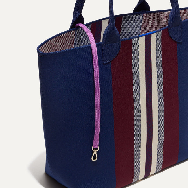 The Lightweight Tote in Oxford Heel Stripe shown with its handy key leash.