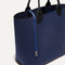 The Lighweight Tote in Sapphire and Onyx shown with its handy key leash.