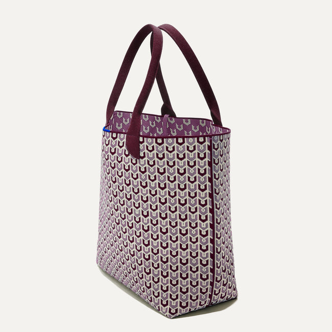 The Lightweight Tote in Signature Plum shown in diagonal view. 